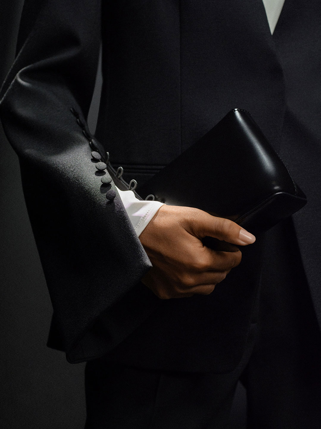 black festive jacket and clutch